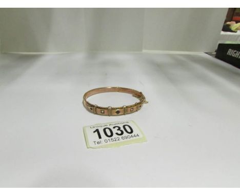 A rose gold bangle