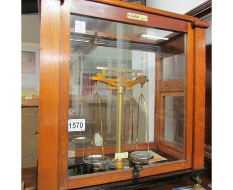 A cased set of Oetling apothecary scales