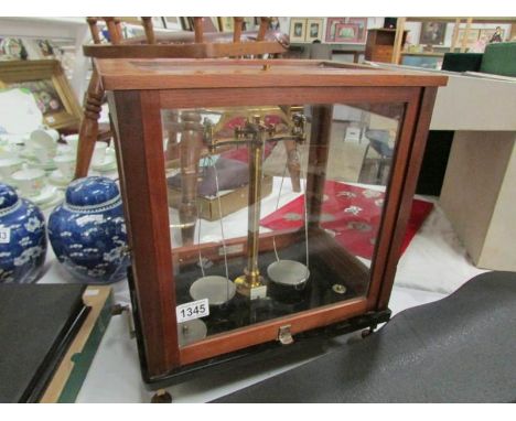 A cased set of German made apothecary scales