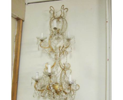 A 6 lamp chandelier style wall light
