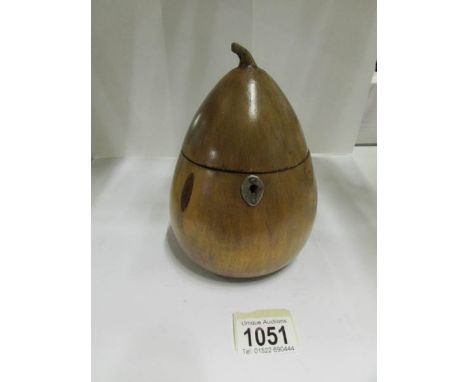 A wooden tea caddy in the shape of a pear