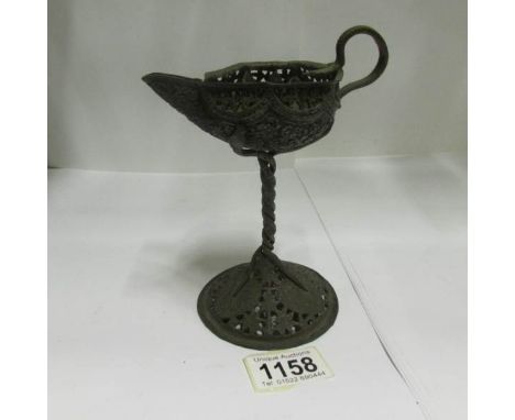An old wick lamp
