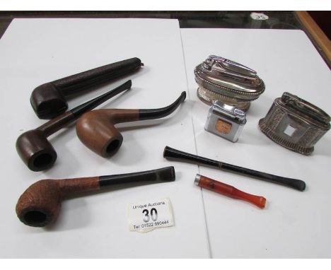 3 vintage cigarette lighters, 2 cigarette holders, 3 pipes and a pipe case