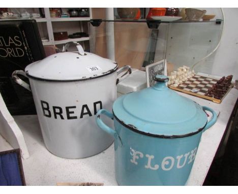 An enamel bread bin and an enamel flour bin