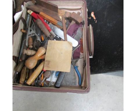 A large quantity of wood chisels and other woodworking tools