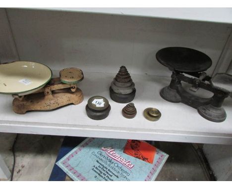2 sets of scales and a quantity of weights