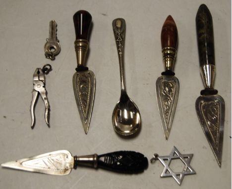 A collection of bookmarks, principally being agate and white metal trowel examples, also a silver pendant formed as a pair of