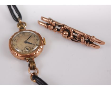 A ladies vintage 9ct gold cased mechanical wrist watch, unsigned, case diameter 22mm, together with a 9ct gold flowerhead set
