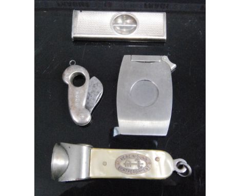 An early 20th century silver pocket cigar cutter of shaped plain undecorated form having folding steel blade, maker's mark ru