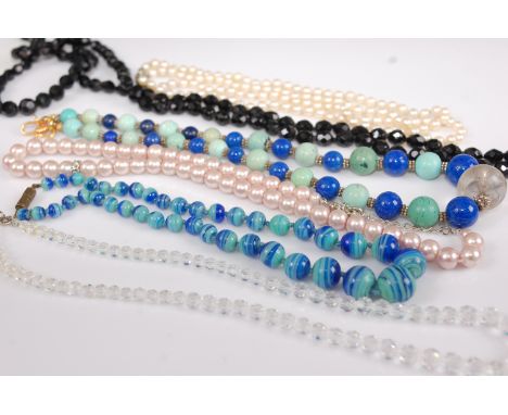 A turquoise and lapis lazuli beaded necklace together with six other vintage necklaces