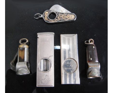 An early 20th century silver guillotine pocket cigar cutter having engine turned decoration, maker's mark rubbed, together wi