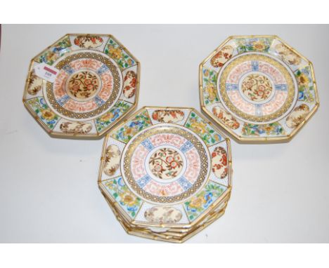 A 19th century Wedgwood part dessert service, each piece of octagonal form and having a central panel with roses, within blue