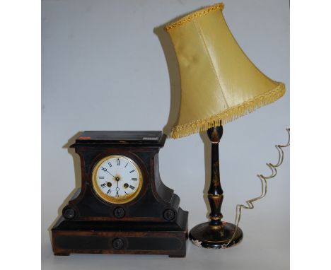 A late 19th century ebonised mantel clock having an enamel dial with eight day movement, together with an early 20th century 