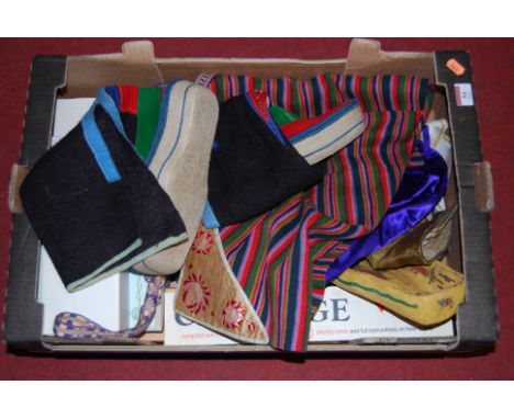A box of miscellaneous items, to include cribbage board and playing cards, various textiles etc