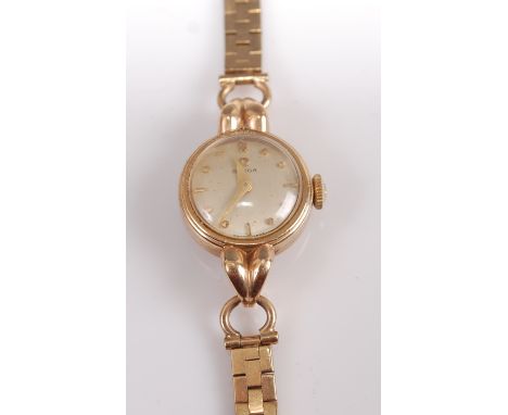 A vintage Omega ladies 9ct gold cased mechanical wrist watch (appears overwound), having a signed champagne dial, case dia. 1