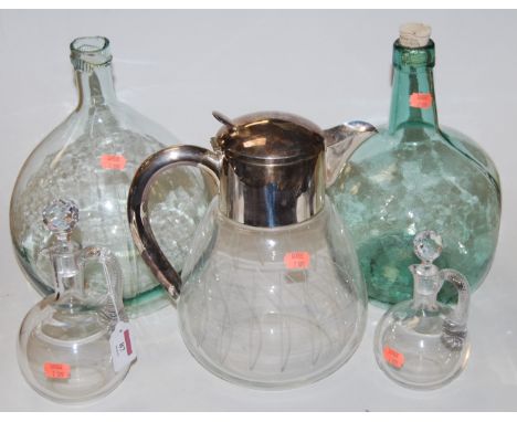 A mid-20th century glass pitcher, having etched body and silver plated mounts; together with a near-pair of early 20th centur