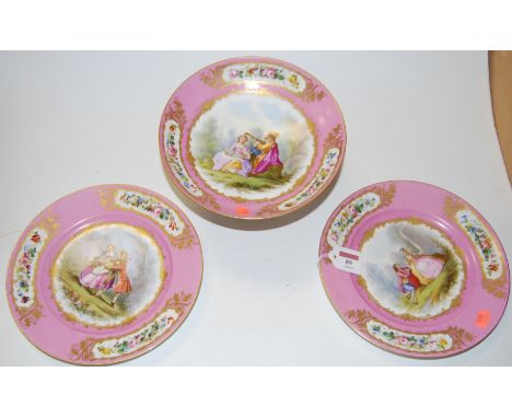 A 19th century French porcelain comport, on a pink ground with floral decoration and heightened in gilt, the central panel de