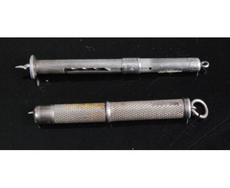 A modern silver propelling cigar piercer having engine turned decoration, maker William Manton, Birmingham 1979, together wit