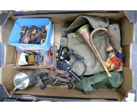 A collection of military items to include a bugle, gas mask, handcuffs, tankards etc