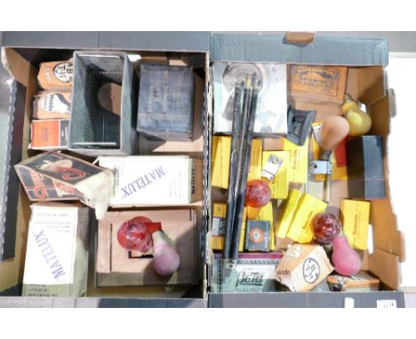 A collection of vintage photographic equipment to include Matelux bulbs, developing bath, Kodak Junior film clips and a tripo