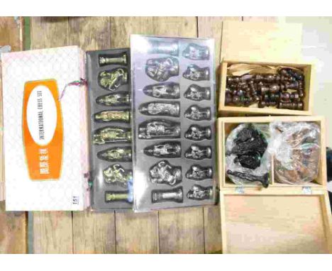 A collection of 4 Chess sets, to include a Manopoulos branded Roman Army style cast metal set, a  vintage 'International Ches