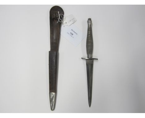 A Wilkinson Sword First Pattern Commando Knife,with curved quillion, the blade marked Wilkinson Sword Co Ltd London, in corre