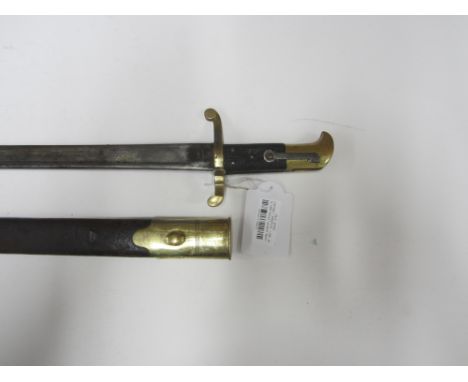 An 1855 Pattern Lancaster Sword Bayonet,with 61cm blade, marked with casque helmet, brass hilt and brass and leather scabbard