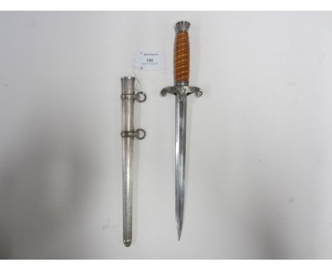 A German Army 1935 pattern dagger,with an unmarked blade 25.4cm, in white metal scabbard. A couple of light nicks to the blad