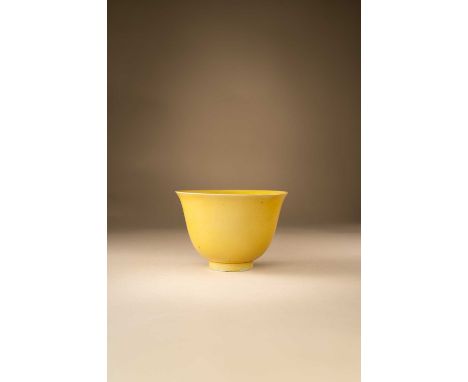 A CHINESE YELLOW-GLAZED BOWLMID 17TH CENTURYThe body with deep rounded sides rising from a circular foot to a flared rim, cov