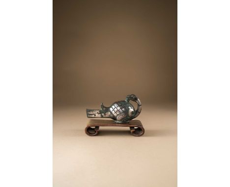 A RARE CHINESE SILVER-INLAID BRONZE BIRD-SHAPED FINIAL, DINGSHIEASTERN ZHOU DYNASTY/WARRING STATEHollow cast as a recumbent b