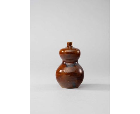 AN UNUSUAL JIANGYOU-GLAZED DOUBLE-GOURD WINE BOTTLEPROBABLY EARLY 18TH CENTURYThe squat gourd-shaped body with a slightly fla