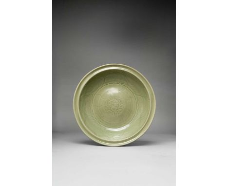 A GOOD CHINESE LONGQUAN CELADON 'PEONY' DISHLATE YUAN DYNASTYWith deep sides and a grooved rim, the centre decorated with an 
