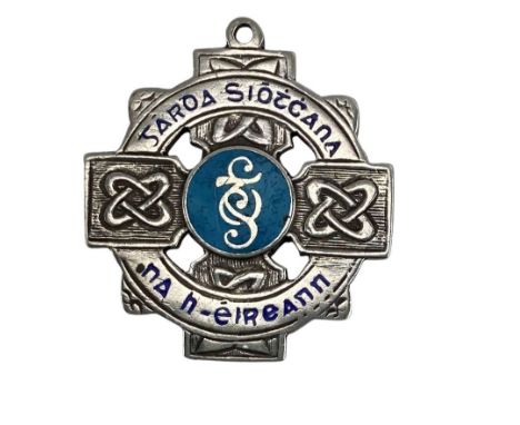 Medal: G.A.A. - [Garda Siochana] the obverse with pierced Celtic design and enamelling inscribed "Garda Siochana na hEireann,