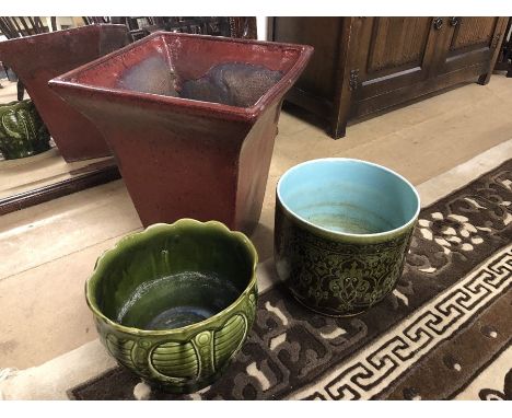 Modern red garden planter, approx 44cm tall along with two green ceramic decorative planters