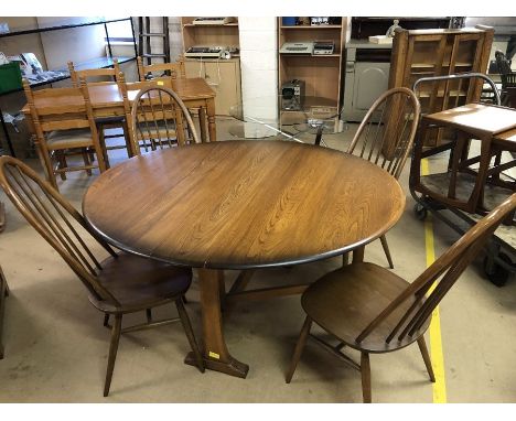 Ercol drop leaf /gate leg dining table, approx 140cm x 128cm extended, with four stick back Ercol dining chairs