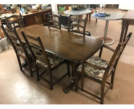 Ercol dining table and six ladder back chairs (two carvers) with detachable cushions, table approx 180cm x 80cm