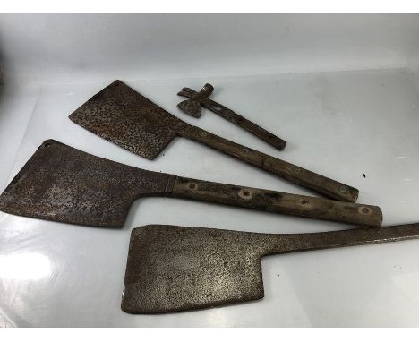 Four vintage tools to include large metal machetes and a small iron axe with claw