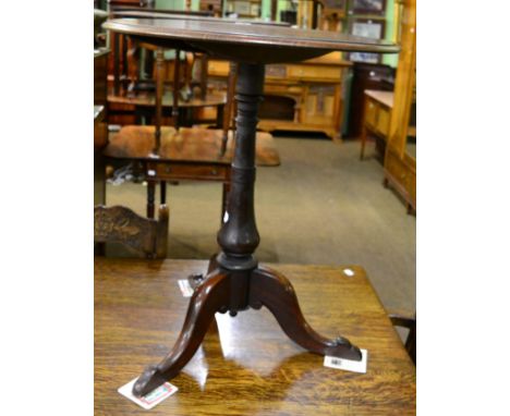 A mahogany tripod table 