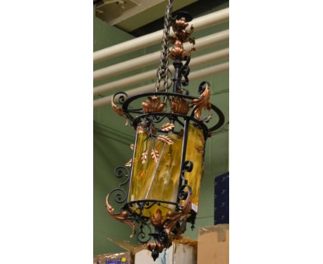 Wrought iron and copper lantern with coloured glass panels, together with two lustre drop light fittings 