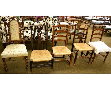 Pair of 19th century oak ladder back chairs, another similar chair, low spindle back ropework nursing chair and a carved maho