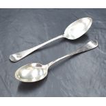 A pair of Victorian silver Hanoverian pattern serving spoons, having an initial engraved to the