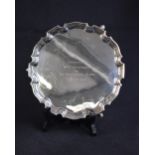 A George VI silver salver, of circular form having a Chippendale style rim, with a central