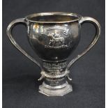 A George V silver Arts & Crafts style trophy, of traditional form having a slightly flared rim,