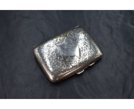 A late Edwardian silver cigarette case of hinged rectangular form slightly curved for the gentleman's pocket, having engraved