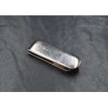 An Elizabeth II silver money clip, of traditional form having a flying kite engraving, marks for