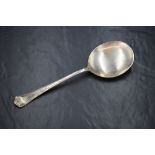 A George VI silver Hanoverian style serving spoon, having an angular terminal and large shallow