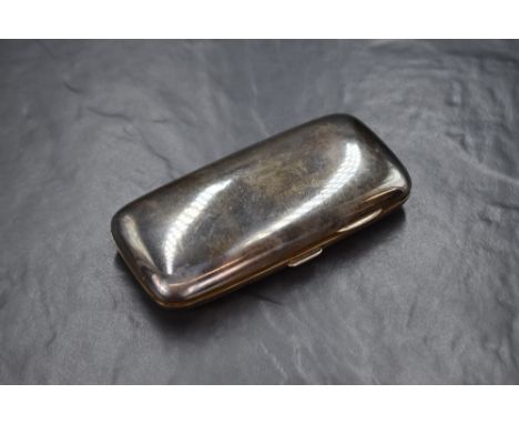 A Victorian silver cigar case, of hinged rectangular form curved for the gentleman's pocket, marks for Birmingham 1898, maker