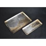 A George V silver pin tray, of rectangular form having decorative scroll and floral swag engraving