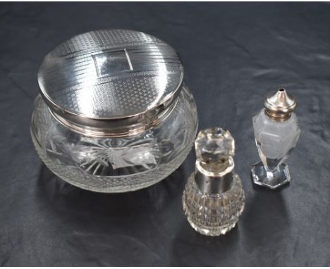 A George V silver capped cut glass powder bowl, having engine turned decoration to the lid, marks for Birmingham 1929, rubbed