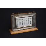 A George V silver mounted perpetual desk calendar, of rectangular form having bead thread